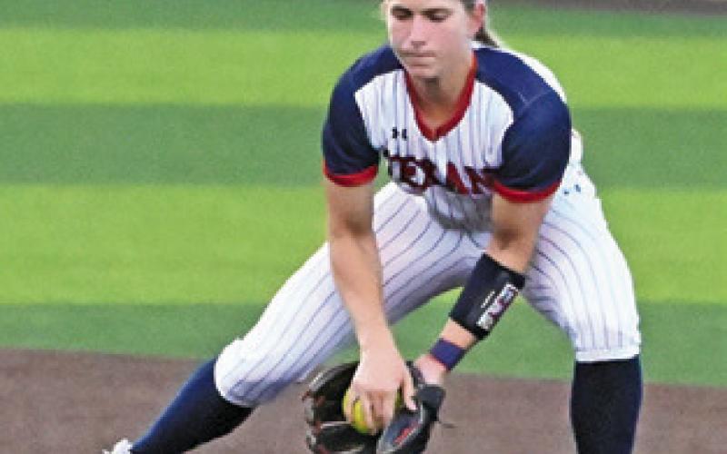 ELLA PATEK fields the ball for a force out at first base during the Wimberley-Liberty state semifinal softball game last Thursday night. Tribune photo by Denise Squier