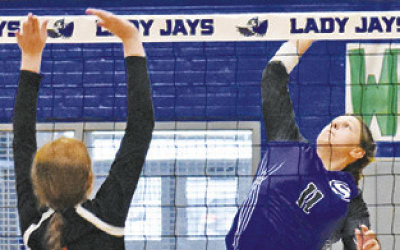 MACKENZIE GROCE reaches to hit the ball during the Lady Jays’ match against Buckholts last Friday in Snook.