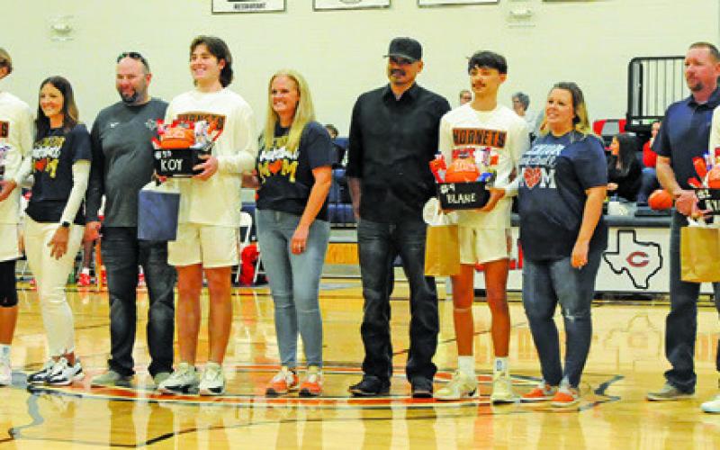 CALDWELL HIGH seniors and their families are recognized at Senior Night last Friday for the Bellville game. They included Dylan Chapman, Koy Macik, Blane Castaneda and Ryan See. Tribune photo by Denise Squier