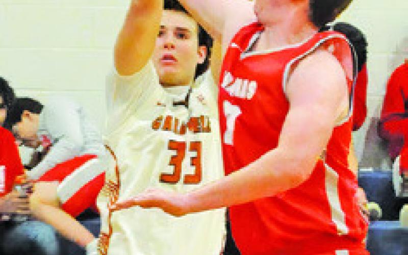 KOY MACIK takes this shot against Bellville in Caldwell’s final home game. Tribune photo by Denise Squier