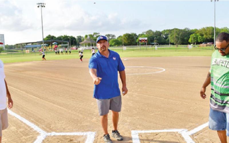 CALDWELL LITTLE LEAGUE Softball’s Shawn Faust flips a coin for the coaches prior to Monday’s Columbus-Hempstead game.