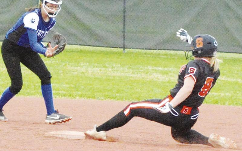 SOMERVILLE’S JALYNN URBANOSKY slides into second base during the Somerville-Bartlett game at the Lady Yegua Softball Tournament last Friday morning at Lady Yegua Field. -- Tribune photo by Denise Squier