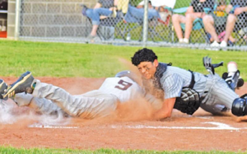 CATCHER VICTOR OROZCO tags this Iola base runner at home in the Yeguas final home game. -- Tribune photo by Roy Sanders