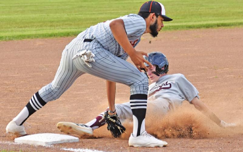 JULIAN FRAYRE OF Somerville tags this Iola player at third base. The Yeguas are playoff-bound. -- Tribune photo by Roy Sanders