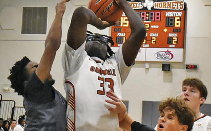 JAGOREAN HEWITT TAKES a shot on Thursday against Bryan JV in the first round of the Kolache Capital Tournament. Tribune photo by Roy Sanders