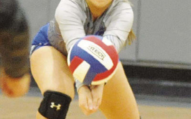 NADIA GARCIA lunges to return service during the Snook-Somerville match on Friday.