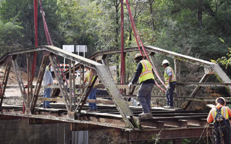 TAKEN JUST MOMENTS before the bridge was removed, this is the final photo of the old iron bridge intact at County Road 146.