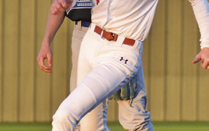 GREG LASEUR rounds the bases against Anderson-Shiro last Thursday. Tribune photo by Roy Sanders