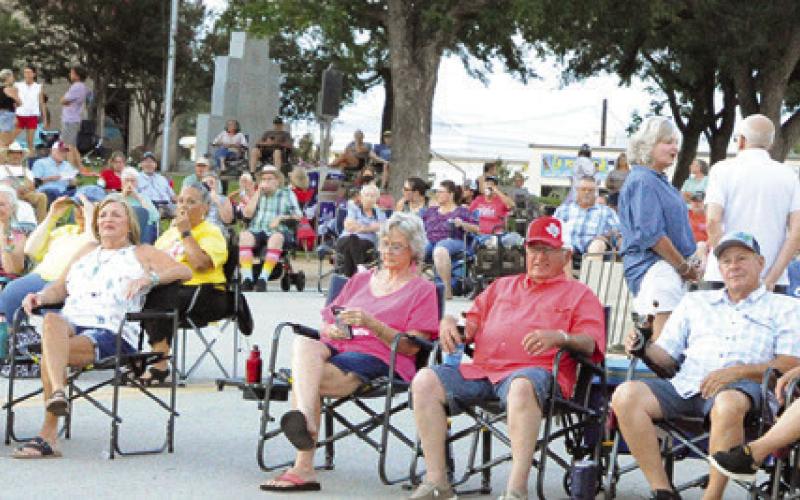 RESIDENTS FROM ACROSS THE COUNTY brought their lawn chairs to listen to People’s Choice Band from Austin at last Saturday night’s “Summer Concert Series.” Tribune photo by Denise Squier