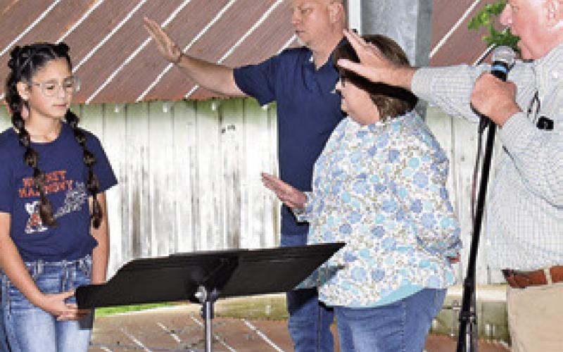 LOCAL PASTORS PRAY over students at Caldwell Intermediate School during National Day of Prayer celebration on Thursday, May 2, at the pavilion in Caldwell.