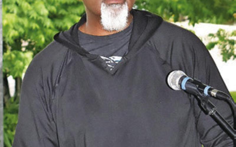 PASTOR THURMAN SIMS Sr., speaks to the audience at the National Day of Prayer celebration on Thursday, May 2, at the pavilion in Caldwell. -- Tribune photo by Roy Sanders