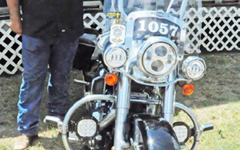 TIM OWENS POSES with his motorcycle at Saturday’s “Blessing of the Bikes.” Tribune photo by Denise Squier