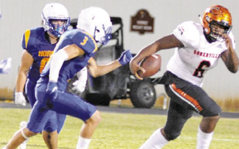 SOMERVILLE’S CADEN ESPINOSA carries the ball against Louse. Somerivlle won 14-13. -- Tribune photo by Denise Squier
