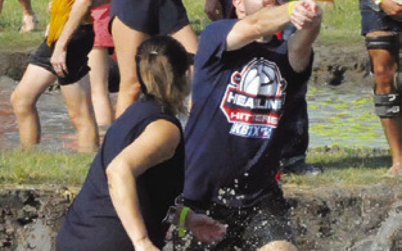 MUD PIT VOLLEYBALL was featured at Saturday’s annual Hog Splash in Snook, a fundraiser for Hospice Brazos Valley. Tribune photo by Denise Squier