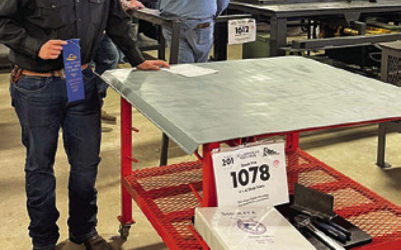 MASON HAHN OF SNOOK FFA earned a blue ribbon at the SALE Ag Mech show with his shop table. Hahn also earned his Welding 2F Certification at SALE. Photo courtesy of Nicole Godwin