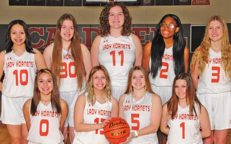 THE 2021-2022 CALDWELL HIGH SCHOOL LADY HORNET junior varsity basketball team is, from left, back, Chassidy Rogers, Anna La Fountain, Kailynn Boyd, Ka’Myra Knoxson, Jordan Perkkio, front, Anjolina Fiebig, Taylor Butters, Kelly Urbanovksy and Makayla Jantzen. -- Photo courtesy of Dianne Pursch Photography
