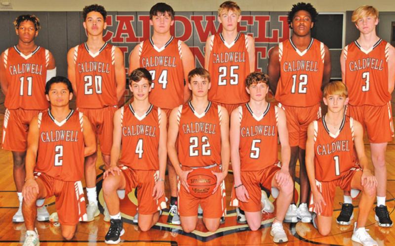 THE 2021-2022 CALDWELL HIGH SCHOOL HORNET junior varsity orange basketball team is, from left, front, Adian Torres, Grant McManus, Waylon Chapman, Nathan Scott, Dylan Chapman, back, Tony Butler, Braedan Carter, Preston Supak, Daniel Cowan, Malik Bradford and Boone Turner. -- Photo courtesy of Dianne Pursch Photography