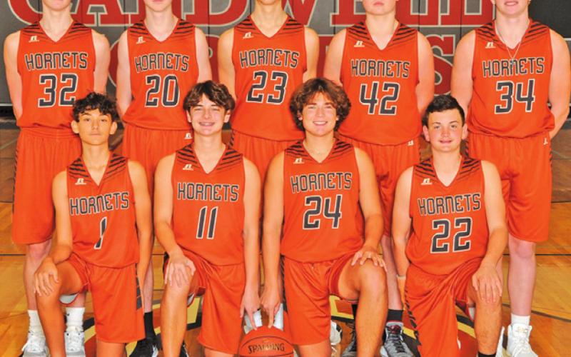 THE 2021-2022 CALDWELL HIGH SCHOOL HORNET junior varsity white basketball team is, from left, front, Blane Castaneda, Cooper Ellis, Kiefer Ellis, Cody Elkins, back, Kaden Roskey, Braide Nelson, Cooper Odenbach, Koy Macik and Corbin Steward. -- Photo courtesy of Dianne Pursch Photography