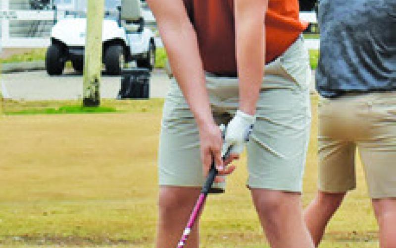 KADEN FRITSCHE ties off for the Hornets on Feb. 3 at Copperas Hollow Country Club.