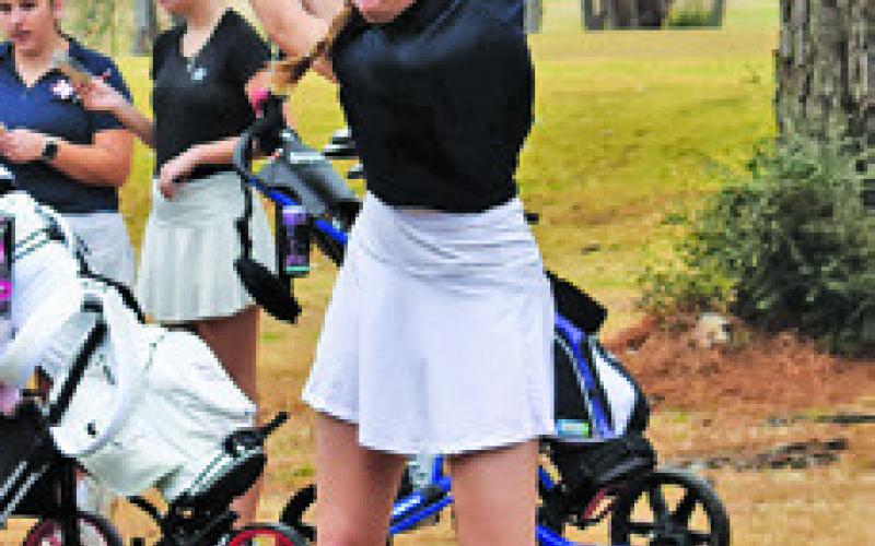 MADILYN SCHNEIDER ties off for the Caldwell Lady Hornets at the tournament.