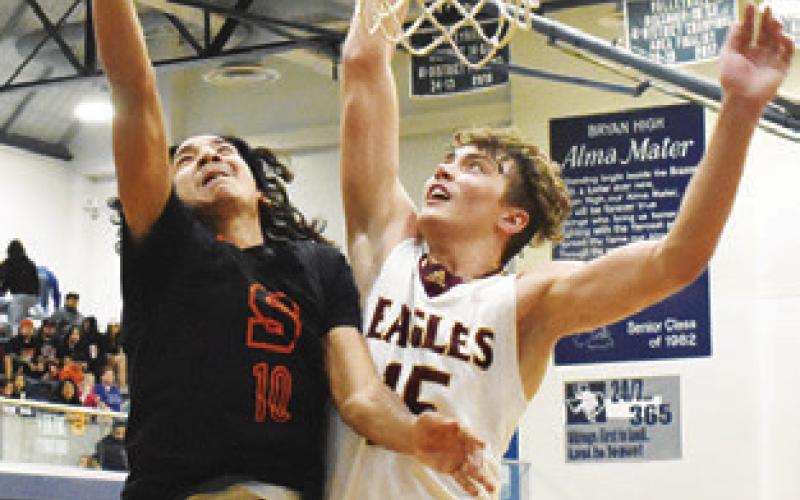 GARDNER SHIVERS of Somerville shoots against Milano. The Yeguas lost the area game 60-49. Tribune photo by Roy Sanders