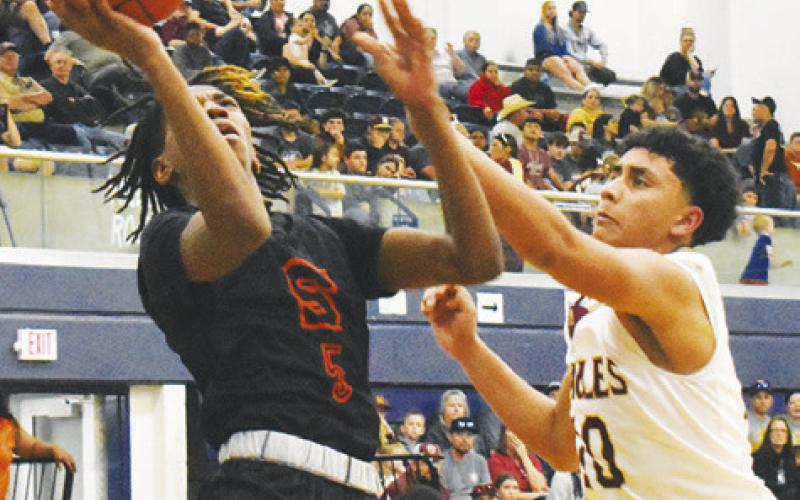 BRANDYN CARTER OF Somerville takes a shot against Milano.