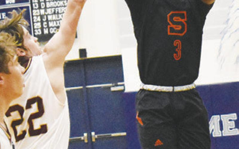 D.J. BRYANT of Somerville hurls a jump shot against Milano. The Yeguas lost the area game 60-49. -- Tribune photo by Roy Sanders