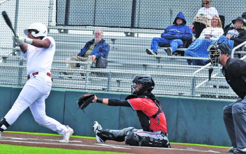 MATTHEW REVILLA BATS for the Caldwell Hornets on Saturday against Smithville. Tribune photo by Roy Sanders