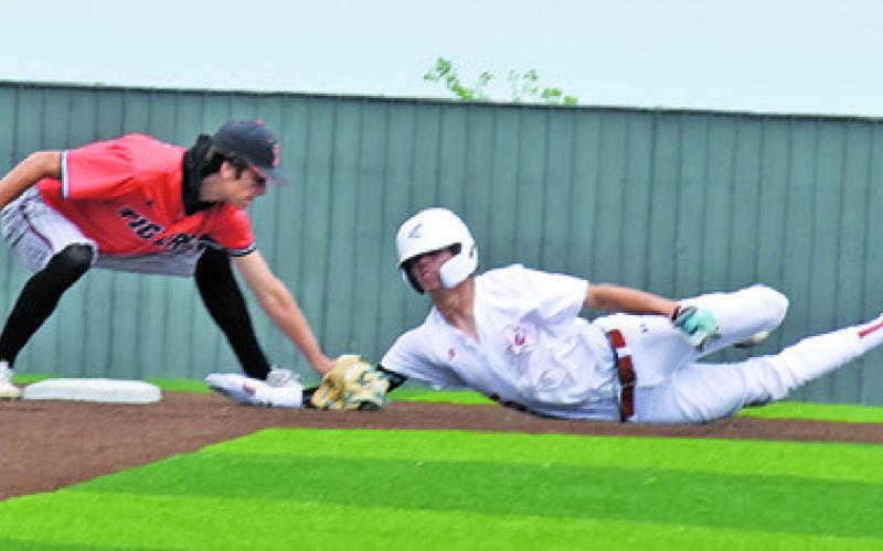 CHASE FAUST SLIDES to second on Saturday against Smithville. Tribune photo by Roy Sanders