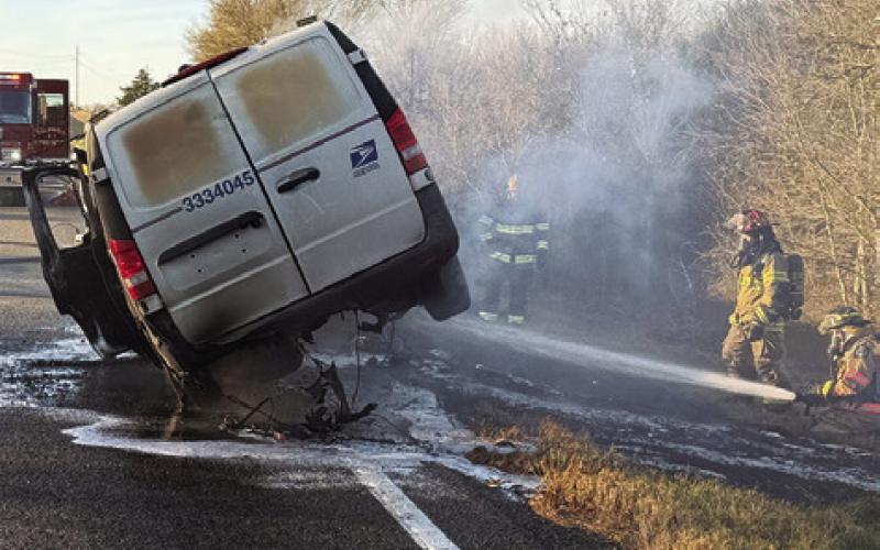 FIREFIGHTERS WORK THE scene of this U.S. Postal Service van fire on Wednesday, Dec. 31, off F.M. 3058. Photo courtesy of Caldwell Volunteer Fire Department