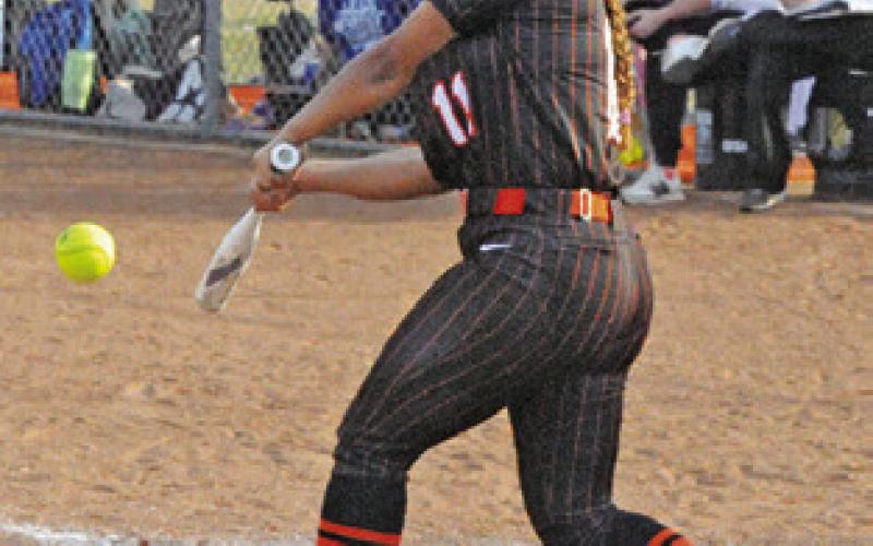 CAPRI ALEJANDRO hits the ball during the Lady Yeguas’ win over Leon last Thursday. Tribune photo by Denise Squier