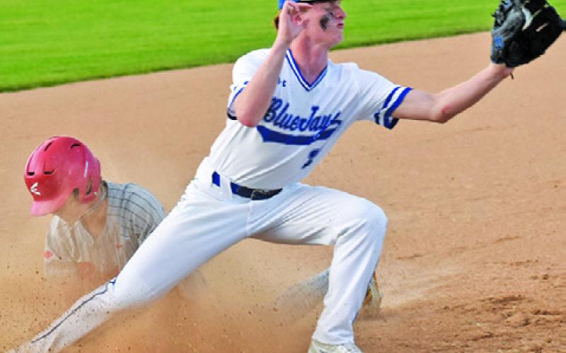 BRENT TURNER OF Snook makes this catch at third base. Tribune photo by Roy Sanders