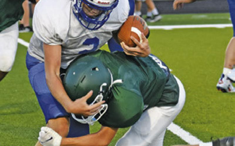 SNOOK’S KADE JUNEK carries the ball against Normangee in the scrimmage.
