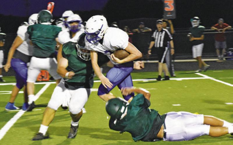 LIAM ZEQUEIRA CARRIES THE ball for Snook in their Friday, Aug. 11, scrimmage against Normangee and Bluejay Stadium. -- Tribune photo by Roy Sanders
