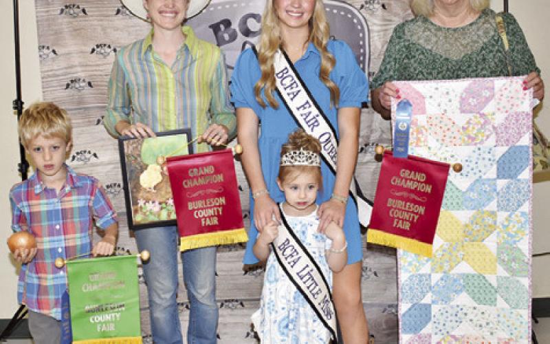 RORY CHATWIN WON grand champion for produce, Ivy Chatwin for adult watercolor, collage, unusual farm product, garden produce, shrubbery and landscape, insect and fire art floral photography. Ruth Albright won grand champion for miscellaneous quilting. Also pictured are Burleson County Fair Queen Hadleigh Novosad and Burleson County Fair Little Miss Avery Grace Freeman.