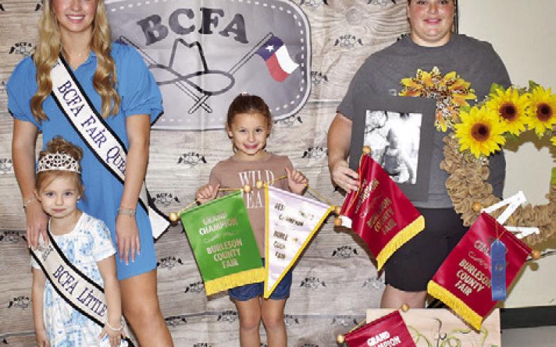 ALLISON HUNDLE WON grand champion at the Burleson County Fair for a photo of an insect, and Kaycie Muzny won for a wreath, a picture and a painting. Joining them are Burleson County Fair Queen Hadleigh Novosad and Little Miss Avery Grace Freeman.