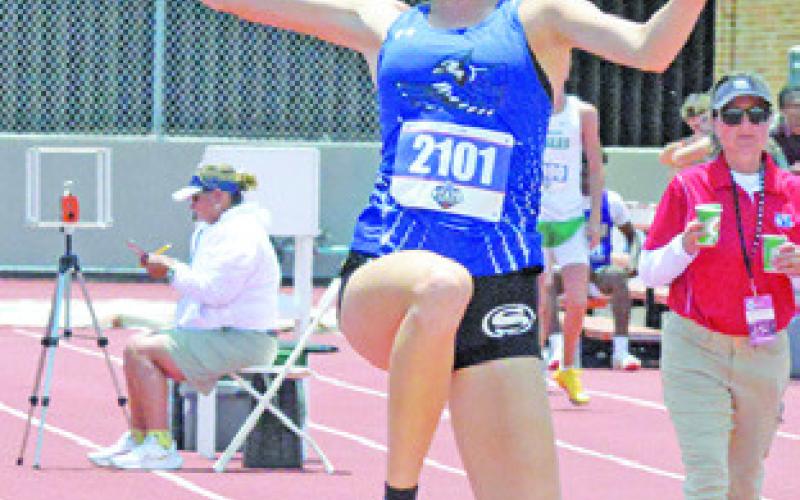 SNOOK’S DAKOTA KIENOW competes in the Class 2A girls triple jump on Friday during the UIL State Track &amp;amp; Field Meet. Tribune photo by Denise Squier