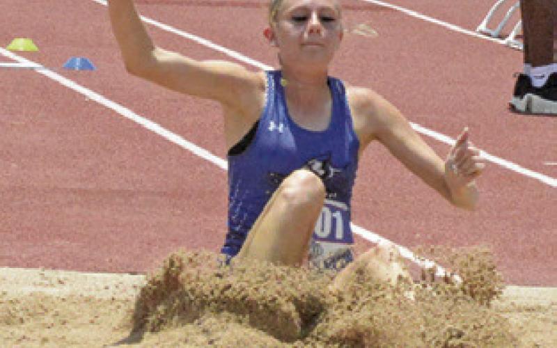 SNOOK’S DAKOTA KIENOW makes her landing in the Class 2A girls triple jump on Friday during the UIL State Track &amp;amp; Field Meet. Tribune photo by Denise Squier
