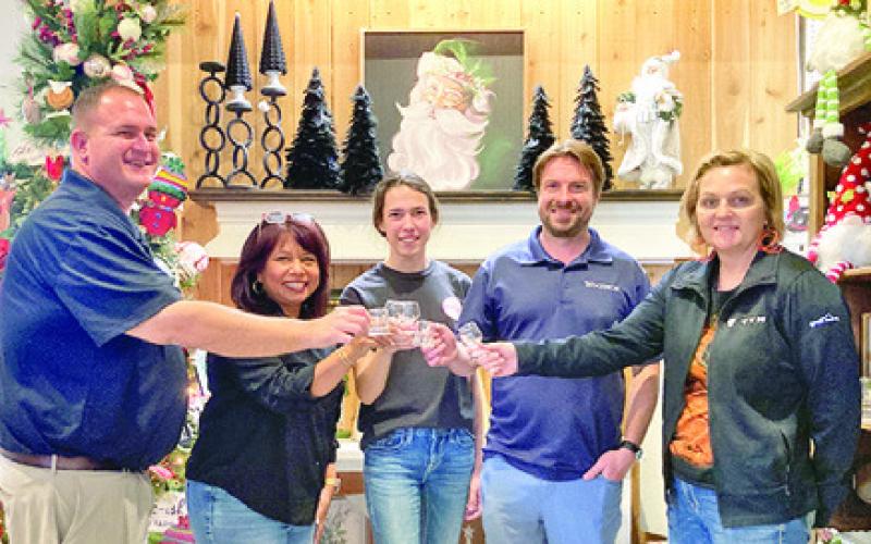 THE BURLESON COUNTY CHAMBER of Commerce is hosting its “Toasting in the ‘Well” beer and wine walk this Saturday. Pictured, from left, are Brian Broaddus, Susan Mott, Kaylee Odstrcil, Stu Chapman and Sharon Livengood. Tribune photo by Sabine Lazo