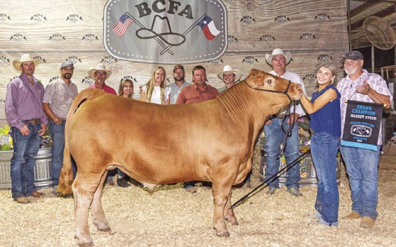 THE 2024 BURLESON COUNTY FAIR’S GRAND CHAMPION Market Steer was exhibited by Madalyn Faust. She is pictured with Jeff Baldwin, Branden Faust, Stephen Hibbeler, Margaret Hibbeler, Holdyn Novosad, Cody Novosad, Brad Novosad, Hank Herrmann, Jeff Brown and Josh Hill. The 2024 fair sale totals once again surpassed the $2 million mark. Photo courtesy of Jeffries Livestock Marketing