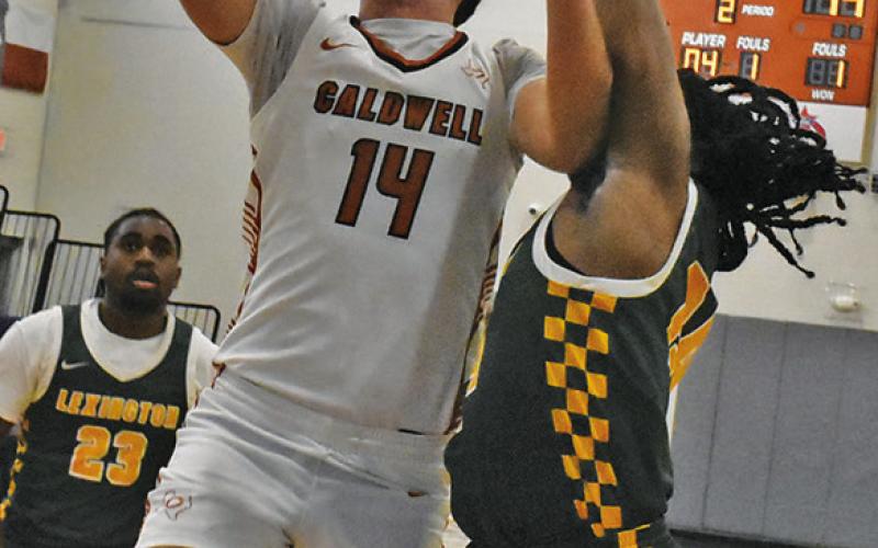 JOHN FRYREAR shoots against Lexington. Tribune photo by Roy Sanders