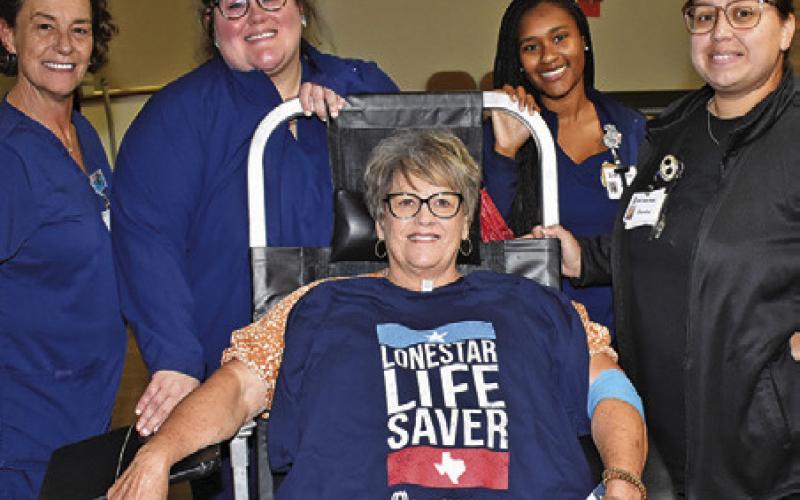 JUDY KOCUREK DONATES blood at a replenishment blood drive in honor of her granddaughter Lynnlee Kocurek last Sunday, April 19, at the Sons of Hermann Hall in Deanville. She is joined by Michelle Hartmann, Kayla Cox, Aunisti Jones and Sandra Hernandez Minifee of Gulf Coast Blood.