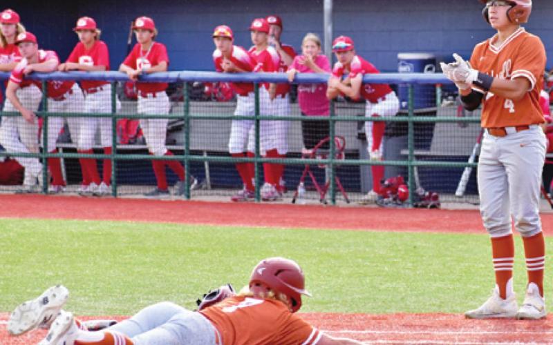 TANNER KUBICEK SLIDES into home plate as Kain Sanchez watches.