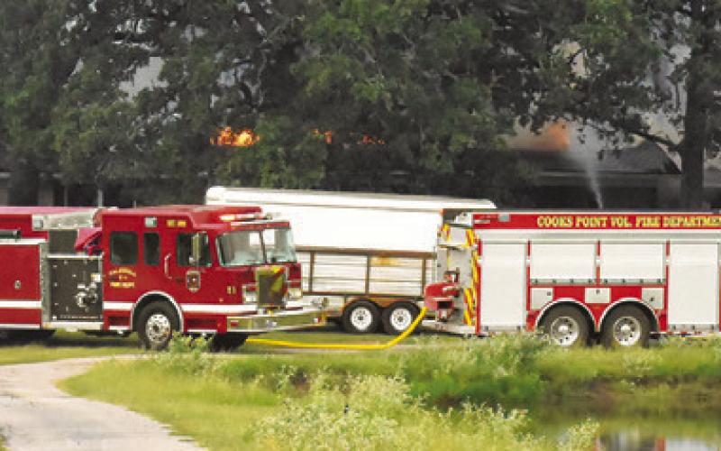AREA FIREFIGHTERS RESPOND to this house fire on July 16 on F.M. 1362 South.