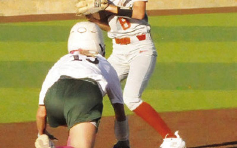 JILLIAN VYKUKAL steps on the bag for an out and checks the runner at first during the Caldwell- Lexington game during this year’s Lady Hornet Softball Tournament.