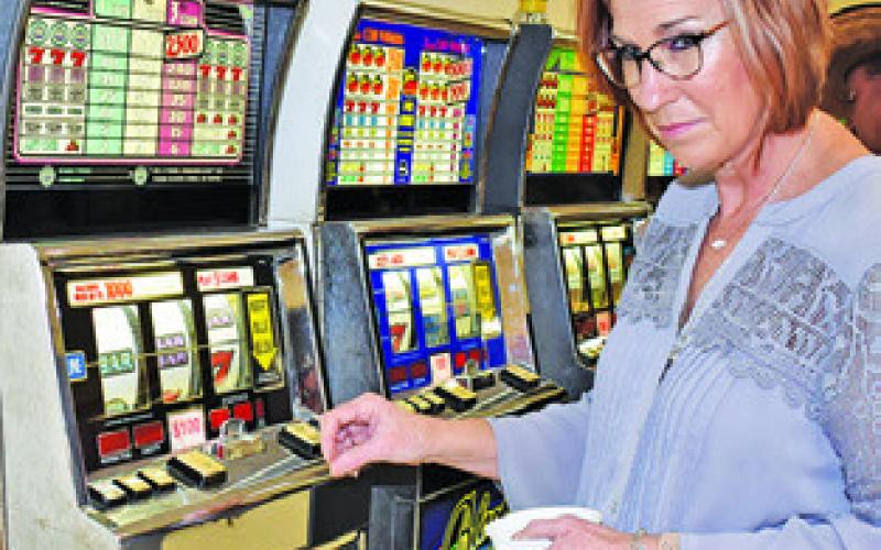 MELISSA BRUNE enjoys the slot machines at last year’s Caldwell Rotary Club Casino Night. The club is gearing up for this year’s event.