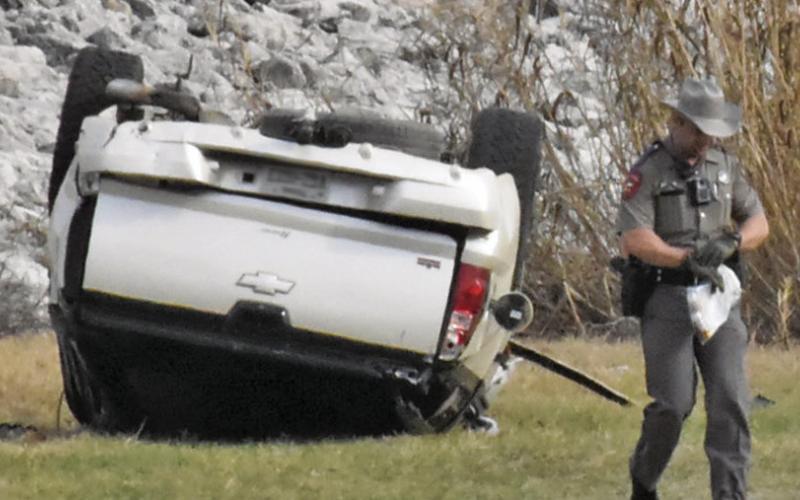 THIS TRUCK IS overturned after a rollover accident on the Lake Somerville Dam road on Saturday afternoon. Tribune photo by Roy Sanders