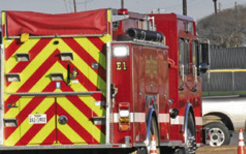 AREA FIREFIGHTERS participate in a defensive driving course for firefighters provided by TEEX on Saturday the Caldwell High School Parking Lot. Firefighters had to drive through the cones. Tribune photo by Roy Sanders