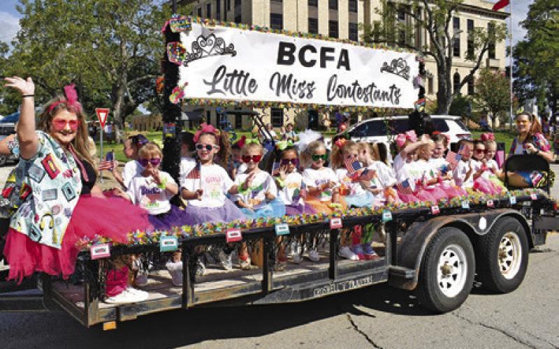 LITTLE MISS CONTESTANTS wave to the crowd during last Saturday’s Burleson County Fair Parade in downtown Caldwell. Tribune photo by Roy Sanders
