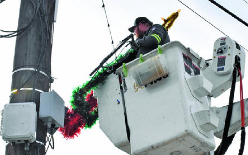 CHRISTMAS DECORATIONS ARE removed by the City of Caldwell on Monday, Jan. 5, in downtown Caldwell. Tribune photo by Roy Sanders
